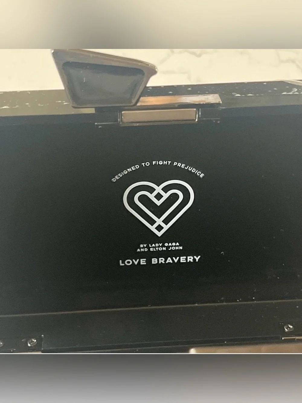 NIB Love Bravery Lady Gaga Elton John Women's Black Graphic Clutch  Face Accent